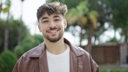 Canvas Print - Young arab man smiling confident standing at park