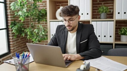 Sticker - Young arab man business worker using laptop stretching arms at office