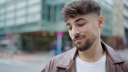 Sticker - Young arab man smiling confident standing at street