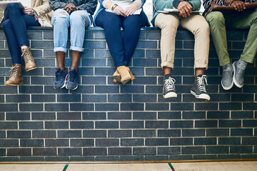 Poster - Closeup, legs and students with education, wall and knowledge on a break, relax and university. Zoom, group and young people with sneakers, shoes and campus with fashion, scholarship and opportunity