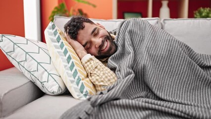 Sticker - Young hispanic man lying on sofa sleeping at h