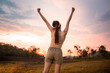 © tonefotografia - Silhouette woman over golden sunset background feeling happy successful in her life