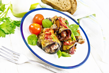 Poster - Rolls of eggplant with meat in plate on wooden table