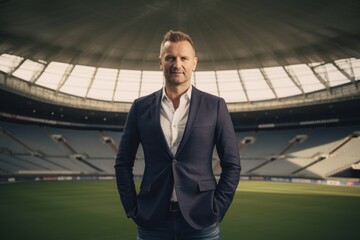 Group portrait photography of a grinning man in his 40s wearing a classic blazer against a sports stadium or arena background. Generative AI