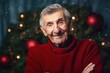 © Robert MEYNER - Portrait of a senior man in red sweater on Christmas background.