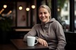 © Robert MEYNER - Pet portrait photography of a pleased woman in her 30s wearing a comfortable tracksuit against a coffee shop or cafe background. Generative AI