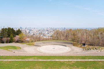 Wall Mural - Panoramic view of Sapporo city and Asahiyama Memorial Park at spring in Sapporo, Hokkaido, Japan