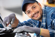 © auremar - auto mechanic working in garage repair service