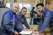 © auremar - group of woodworker posing and smiling