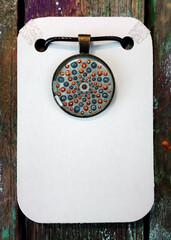 Wall Mural - Beautiful grey pendant with point painting. Jewelry for women.