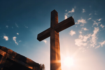 Beautiful wooden cross against the blue sky and sun in the background holy cross christ