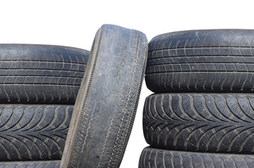 old worn out tire next to another old tire isolated on white background