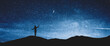 © New Africa - Silhouette of woman in mountains under starry sky at night, space for text. Banner design