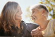 © Grady Reese/peopleimages.com - Family, love or happy with a senior mother and daughter bonding outdoor together during a summer day. Smile, flare and retirement with a young man hugging her elderly parent outside in the park