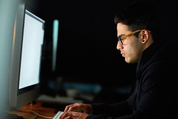 Poster - Computer, typing and man at night for software development, programming update and information technology. Focus, research and geek or programmer person on desktop screen for website cyber security