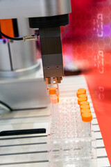 Wall Mural - robot arm with test tube for biological experiments in laboratory