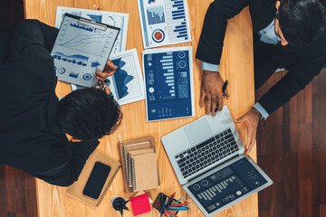 Poster - Top view analyst team discussing financial data on digital dashboard, analyzing chart and graph papers by data science software on wooden table background. Business intelligence and Fintech. Fervent