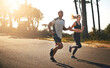 © Donson/peopleimages.com - Fitness, running and freedom with couple in road for workout, cardio performance and summer. Marathon, exercise and teamwork with black man and woman runner in nature for sports, training and race