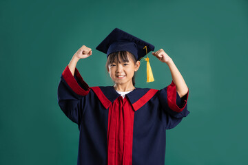 Wall Mural - beautiful asian girl posing on blue background