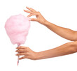 Cotton candy, closeup and woman hands isolated on a white background for sweets, pink food and holiday treat. Person hand holding soft, color cone for youth party, childhood and festival in studio