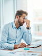 © K Seisa/peopleimages.com - Business man, headache and sick, tired or fatigue in office while working on pc. Burnout, migraine and male person with depression, vertigo or brain fog, anxiety or mental health, stress or problem.