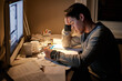 © Marius Venter/peopleimages.com - Man, studying and tired in night by computer for test, assessment or stress in college dorm room. Male university student, education and burnout with fear, fatigue and anxiety with books for learning