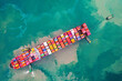 © Teppakorn - Aerial top view container ship full load container for logistics.