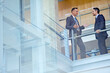 © GR/peopleimages.com - Teamwork, collaboration or business people in office building lobby for communication, planning or speaking strategy. Corporate, manager or employees for meeting, idea discussion or talking together