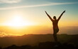 © Prostock-studio - Woman Standing On Top Of Mountain Raising Arms, Back View