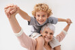 © Nicola Katie/peopleimages.com - Portrait, piggyback or grandma with a happy child or smile hugging with love in family home. Elderly grandmother, boy or fun old woman relaxing, bonding or playing together in retirement on holiday