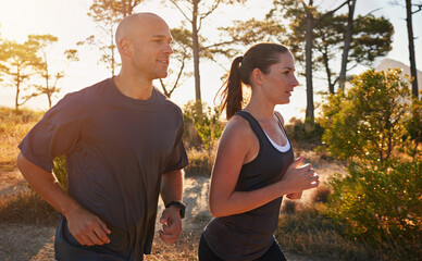 Poster - Sunrise, forest and couple on trail run as workout or morning exercise for health and wellness together. Sport, man and woman runner run with athlete as training on a mountain for sports or energy