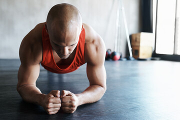 Sticker - Gym, focus and man doing floor plank exercise, health performance or core strength building for bodybuilding. Training, commitment and person concentrate on fitness, muscle development or workout