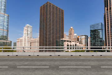 Empty urban asphalt road exterior with city buildings background. New modern highway concrete construction. Concept of way to success. Transportation logistic industry fast delivery. Chicago. USA.