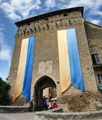 Wall Mural - Colorful banners on city gate 