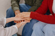 © MyJuly - group therapy of couple psychologist moral support and mental health. close up of hands and handshakes at session psychotherapist. women and men care for support each other. depression and addiction
