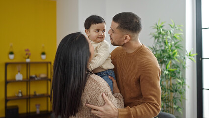 Poster - Couple and son hugging each other standing at home