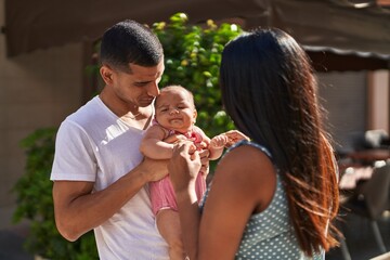 Poster - Hispanic family smiling confident hugging each other at street