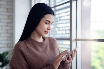 beautiful asian female using mobile phone