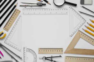 Wall Mural - Flat lay composition with different rulers and compass on white background