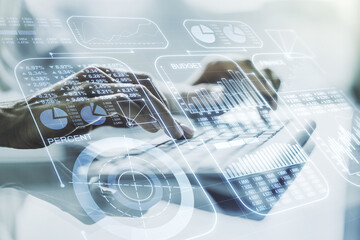 Fototapete - Double exposure of abstract creative statistics data hologram with hands typing on laptop on background, analytics and forecasting concept