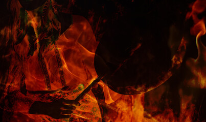 Poster - beautiful shamanic girl playing on shaman frame drum in the nature. Fire background.