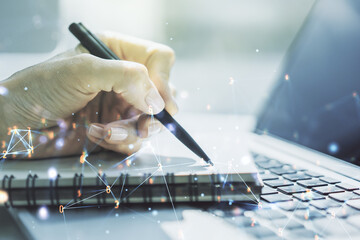 Aufkleber - Creative abstract wireless technology hologram and hand writing in diary on background with laptop, artificial intelligence and machine learning concept. Multi exposure