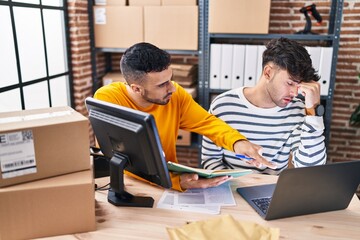 Canvas Print - Two man ecommerce business workers with problem working at office