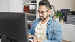 © Krakenimages.com - Young latin man business worker using computer working at office