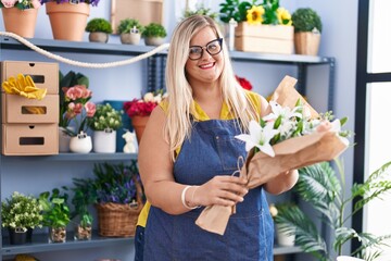 Sticker - Young woman florist holding bouquet of flowers at florist