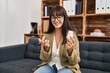 © Krakenimages.com - Young beautiful hispanic woman psychologist prescribe pills treatment speaking at psychology clinic