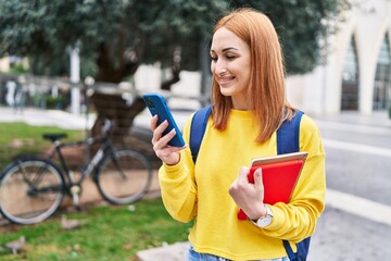 Sticker - Young caucasian woman student smiling confident using smartphone at park