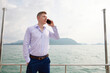 © offsuperphoto - businessman talking by smartphone in luxury yacht