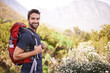 Hiking, happy and portrait of man on mountain for fitness, adventure and travel journey. Backpacking, summer and workout with male hiker trekking in nature path for training, freedom and explore