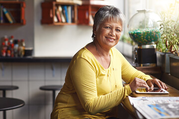 Canvas Print - Portrait, restaurant and senior woman with a tablet, connection and social media with happiness. Face, mature female person and lady with a smile, technology and online reading to relax in a cafe